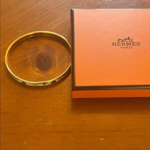Gold and Silver Bangle. Hermes bracelet with box.